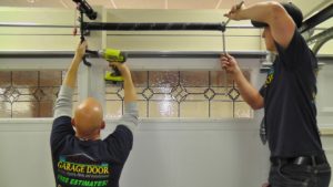 Why should heir a professional garage door repairs